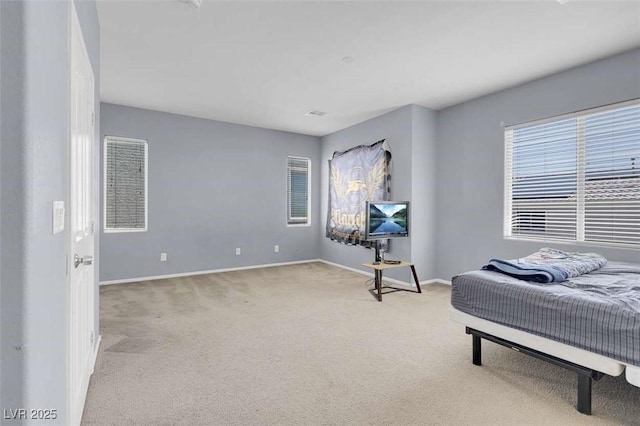 9840 Chief Sky St, Las Vegas, NV 89178 - bedroom featuring light carpet and baseboards