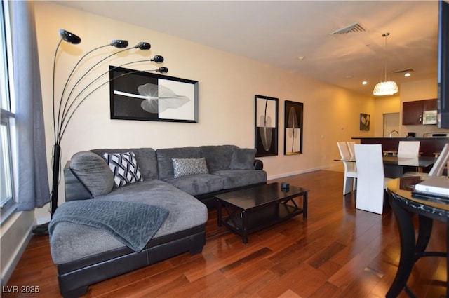 4585 Dean Martin Dr Unit 205, Las Vegas, NV 89103 - living room featuring dark wood-style flooring, recessed lighting, and baseboards