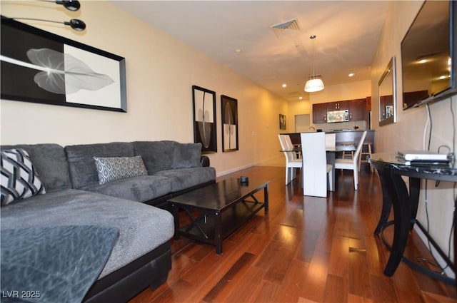 4585 Dean Martin Dr Unit 205, Las Vegas, NV 89103 - living room with dark wood finished floors and recessed lighting