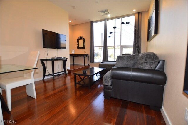 4585 Dean Martin Dr Unit 205, Las Vegas, NV 89103 - living room featuring dark wood-type flooring, baseboards, and recessed lighting