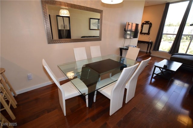 4585 Dean Martin Dr Unit 205, Las Vegas, NV 89103 - dining space featuring baseboards and dark wood-type flooring