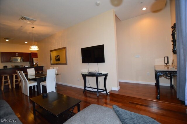 4585 Dean Martin Dr Unit 205, Las Vegas, NV 89103 - living room with wood finished floors, baseboards, and recessed lighting