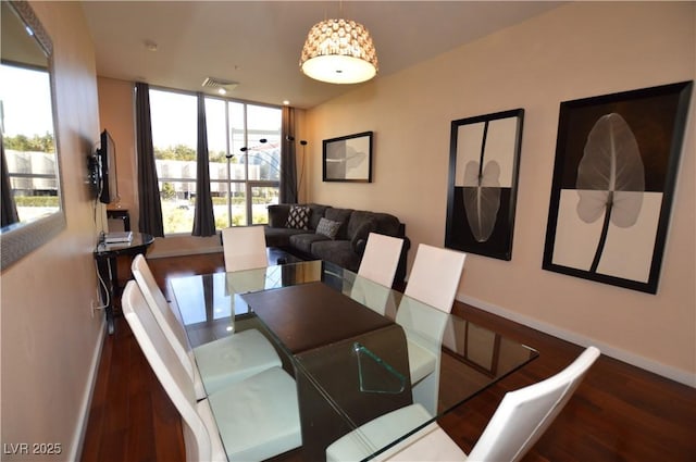 4585 Dean Martin Dr Unit 205, Las Vegas, NV 89103 - dining space with wood finished floors and baseboards