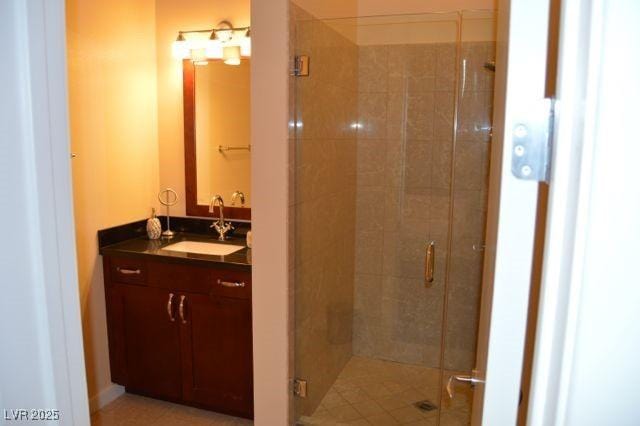4585 Dean Martin Dr Unit 205, Las Vegas, NV 89103 - bathroom featuring a shower stall and vanity