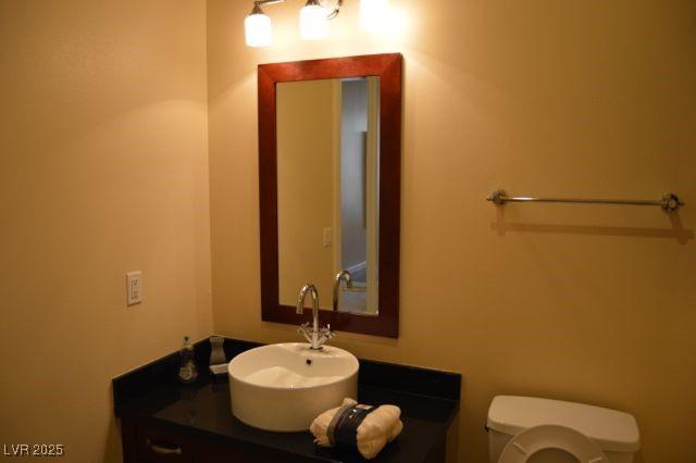 4585 Dean Martin Dr Unit 205, Las Vegas, NV 89103 - bathroom featuring toilet and vanity