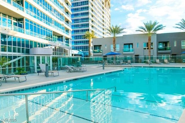 4585 Dean Martin Dr Unit 205, Las Vegas, NV 89103 - community pool featuring a patio area
