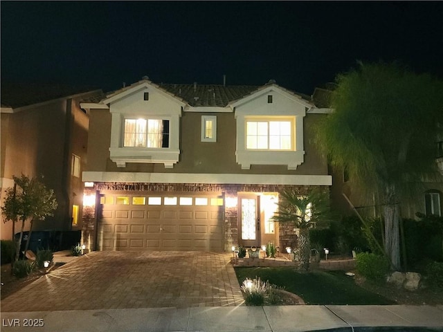 6729 Flamenco Ct, Las Vegas, NV 89139 - view of front of home featuring stucco siding, decorative driveway, and an attached garage