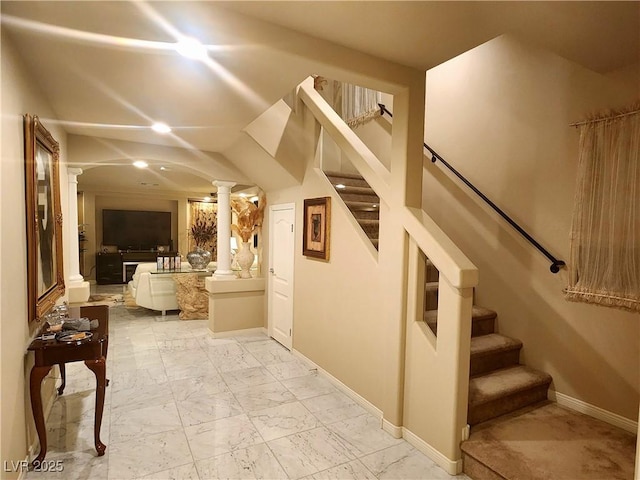 6729 Flamenco Ct, Las Vegas, NV 89139 - corridor featuring decorative columns, stairway, light marble finish floors, and baseboards