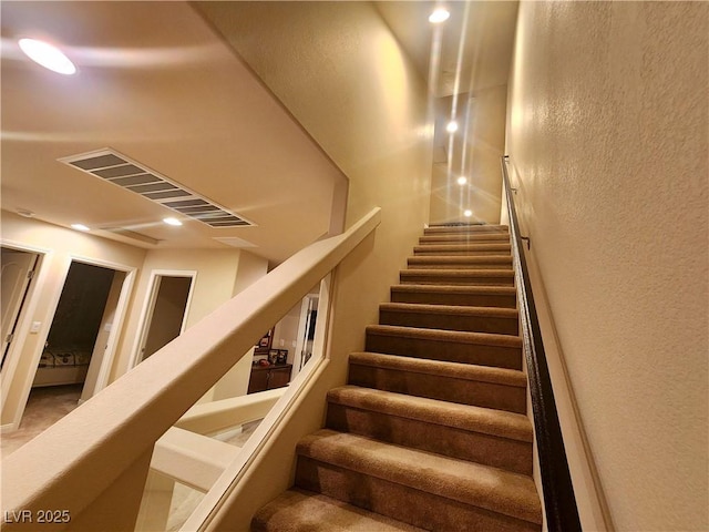 6729 Flamenco Ct, Las Vegas, NV 89139 - staircase featuring a textured wall and recessed lighting