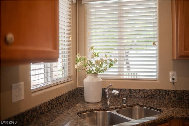 2708 Cheer Pheasant Ave, North Las Vegas, NV 89084 - kitchen view of a sink and dark stone counters
