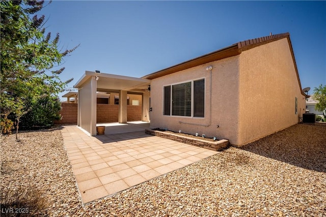 2708 Cheer Pheasant Ave, North Las Vegas, NV 89084 - back of property with a patio, stucco siding, and central AC unit