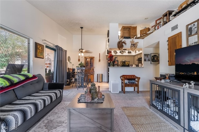 1575 W Warm Springs Rd Unit 2822, Henderson, NV 89014 - carpeted living area with a textured ceiling and ceiling fan