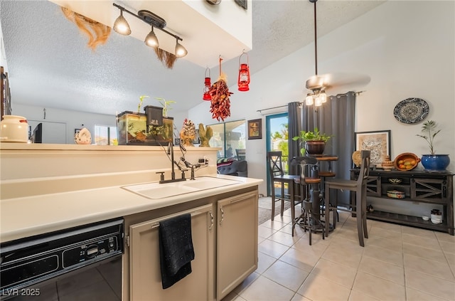 1575 W Warm Springs Rd Unit 2822, Henderson, NV 89014 - kitchen featuring black dishwasher, a sink, healthy amount of natural light, a textured ceiling, and light tile patterned floors