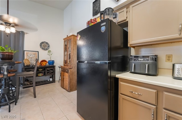 1575 W Warm Springs Rd Unit 2822, Henderson, NV 89014 - kitchen featuring freestanding refrigerator, light tile patterned flooring, light countertops, and ceiling fan