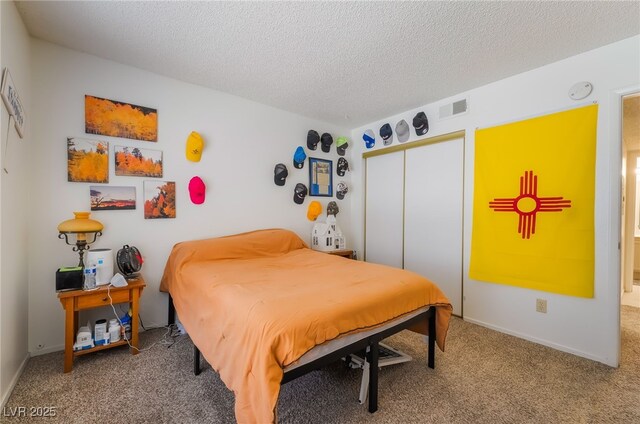1575 W Warm Springs Rd Unit 2822, Henderson, NV 89014 - carpeted bedroom featuring a textured ceiling, a closet, and baseboards