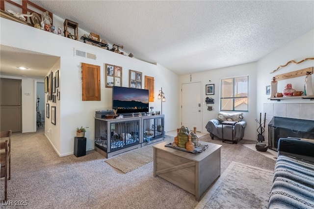 1575 W Warm Springs Rd Unit 2822, Henderson, NV 89014 - carpeted living area featuring a fireplace and a textured ceiling