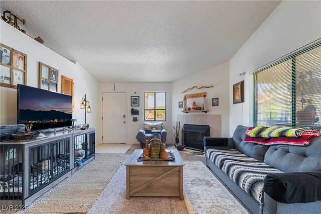 1575 W Warm Springs Rd Unit 2822, Henderson, NV 89014 - carpeted living room with a tile fireplace and a textured ceiling