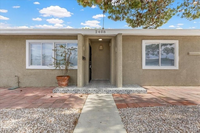 2408 Berkley Ave, Las Vegas, NV 89101 - property entrance featuring stucco siding and a patio area