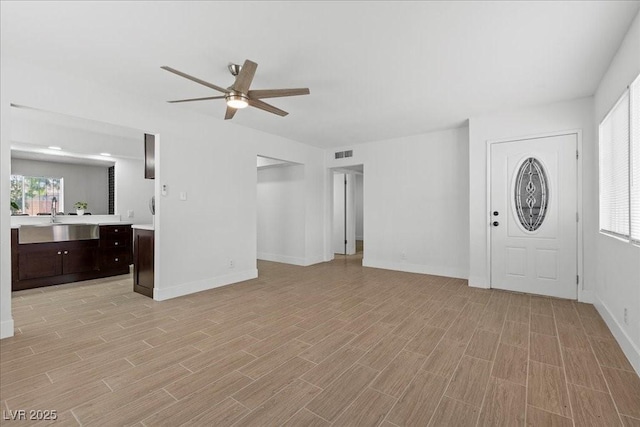 2408 Berkley Ave, Las Vegas, NV 89101 - foyer entrance with a ceiling fan, light wood-style flooring, and baseboards