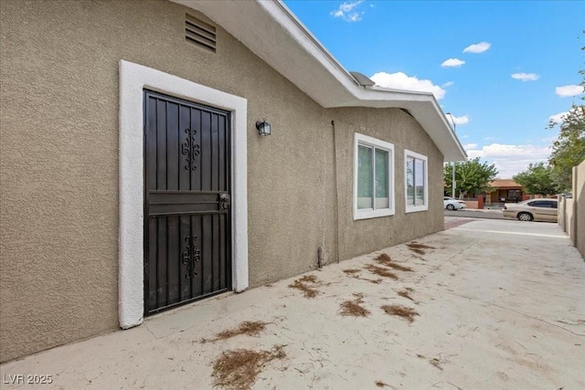 2408 Berkley Ave, Las Vegas, NV 89101 - entrance to property featuring stucco siding and a patio