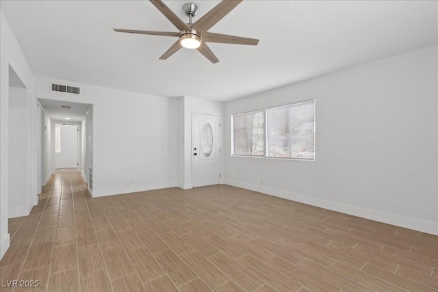 2408 Berkley Ave, Las Vegas, NV 89101 - spare room featuring ceiling fan, light wood-type flooring, and baseboards