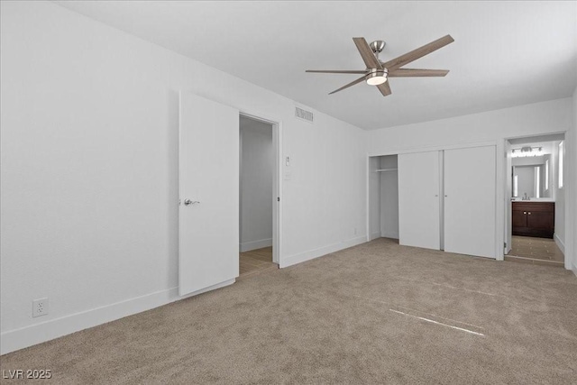 2408 Berkley Ave, Las Vegas, NV 89101 - unfurnished bedroom with carpet, a closet, baseboards, a ceiling fan, and ensuite bath