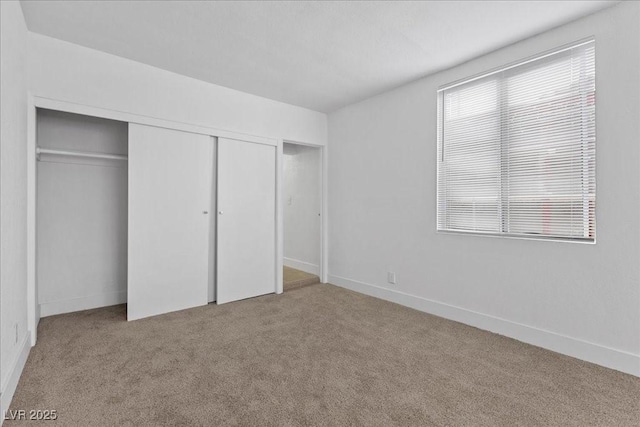 2408 Berkley Ave, Las Vegas, NV 89101 - unfurnished bedroom featuring carpet, a closet, and baseboards