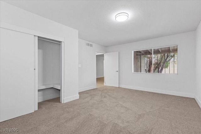 2408 Berkley Ave, Las Vegas, NV 89101 - unfurnished bedroom with carpet flooring, a closet, and baseboards