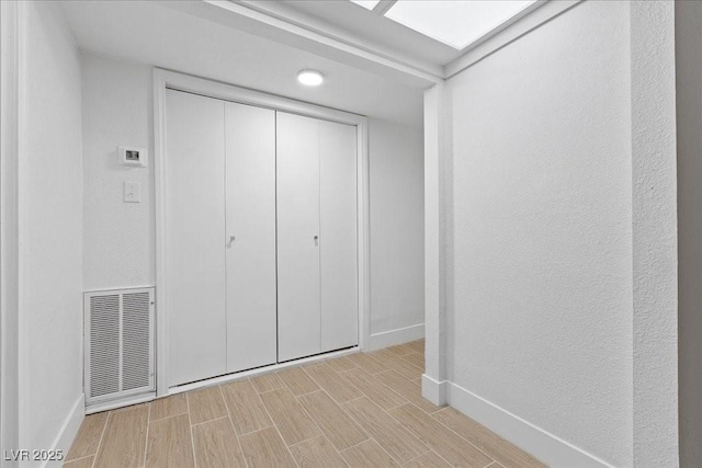 2408 Berkley Ave, Las Vegas, NV 89101 - unfurnished bedroom with baseboards, wood tiled floors, and a closet