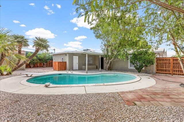 2408 Berkley Ave, Las Vegas, NV 89101 - view of pool with a patio, a fenced backyard, and a diving board