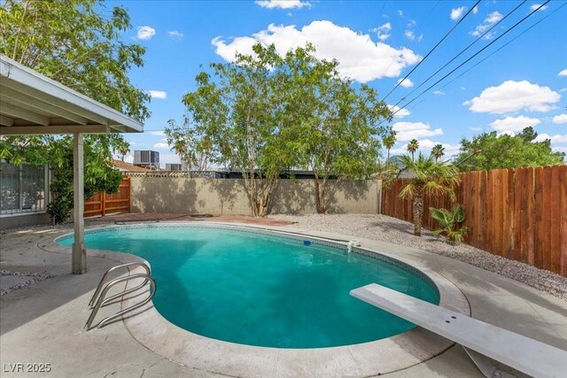 2408 Berkley Ave, Las Vegas, NV 89101 - view of pool with a fenced backyard, central AC, a patio area, and a diving board