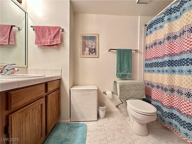4151 Sanderling Cir Unit 351, Las Vegas, NV 89103 - bathroom with vanity, toilet, tile patterned floors, and baseboards