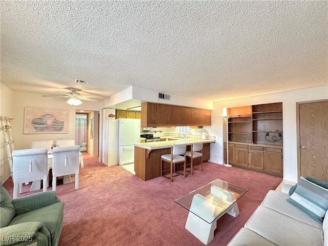 4151 Sanderling Cir Unit 351, Las Vegas, NV 89103 - living area featuring a textured ceiling, light colored carpet, and a ceiling fan