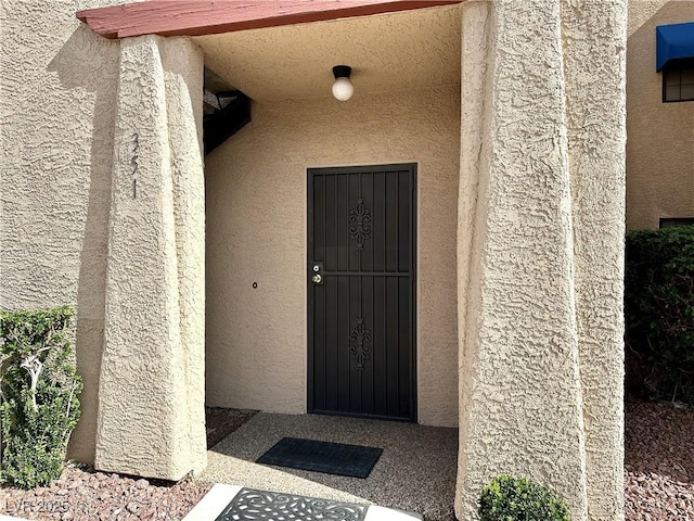 4151 Sanderling Cir Unit 351, Las Vegas, NV 89103 - doorway to property featuring stucco siding