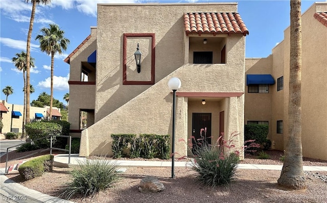 4151 Sanderling Cir Unit 351, Las Vegas, NV 89103 - view of front of house with stucco siding and a tile roof