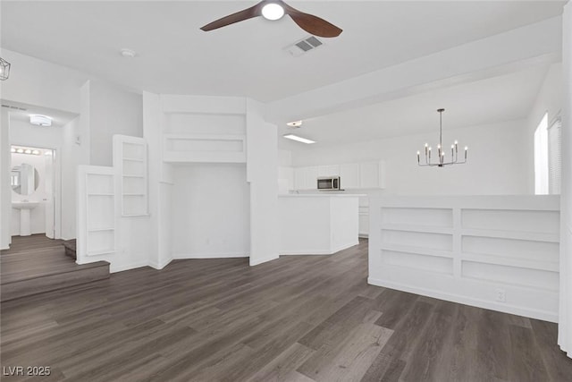 4807 Leadership Ct, North Las Vegas, NV 89031 - unfurnished living room with a ceiling fan, a chandelier, dark wood-style floors, a sink, and baseboards