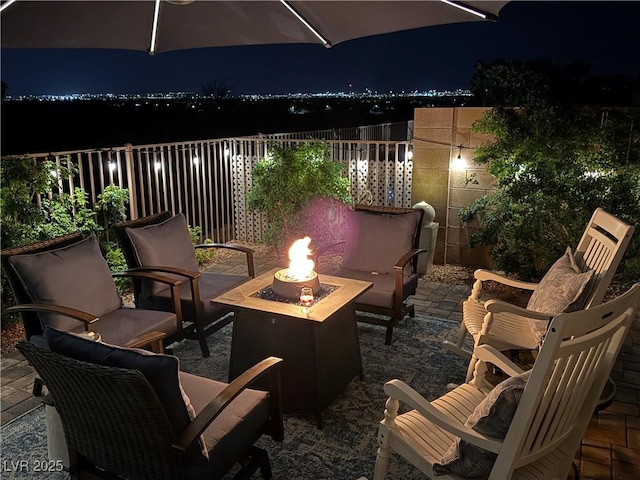 7029 Bocaire Dr, Las Vegas, NV 89131 - patio at twilight featuring an outdoor fire pit and a patio