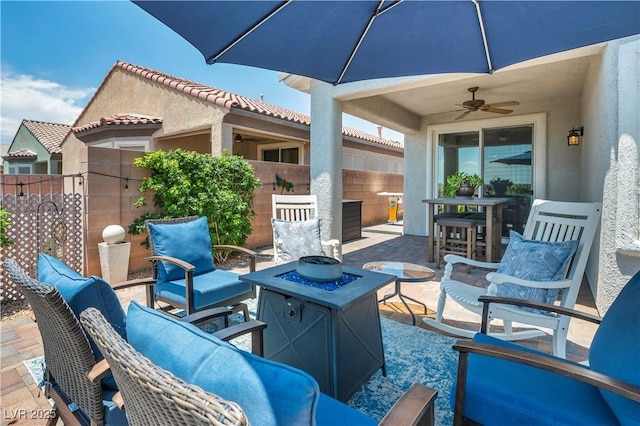 7029 Bocaire Dr, Las Vegas, NV 89131 - view of patio featuring ceiling fan, a fire pit, and outdoor dining space