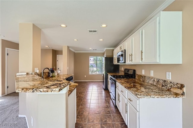 7382 Elbridge Way, Las Vegas, NV 89113 - kitchen with appliances with stainless steel finishes, a peninsula, white cabinets, light stone counters, and recessed lighting
