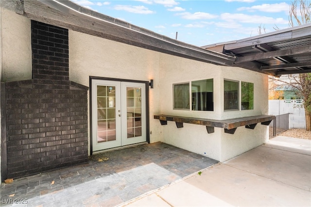 3409 El Cortez Ave, Las Vegas, NV 89102 - view of exterior entry featuring french doors, stucco siding, and a patio area