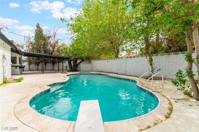 3409 El Cortez Ave, Las Vegas, NV 89102 - view of pool featuring a patio, a fenced backyard, and a diving board