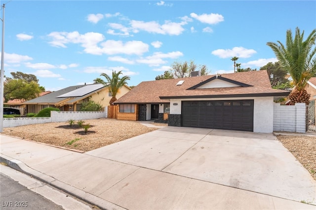 3409 El Cortez Ave, Las Vegas, NV 89102 - ranch-style home with a garage, concrete driveway, stucco siding, and a shingled roof