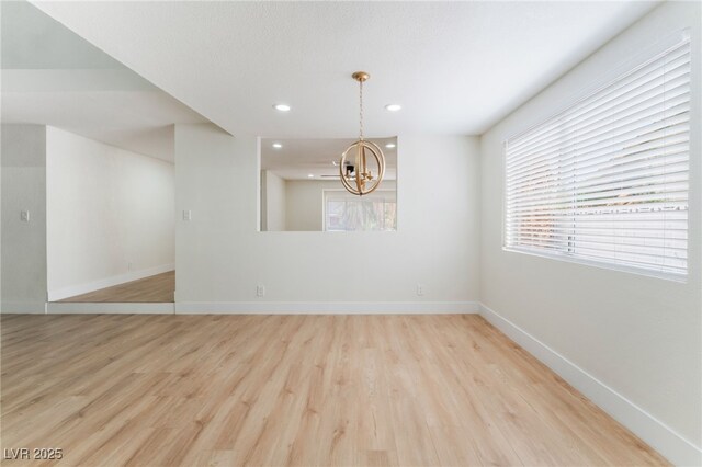3409 El Cortez Ave, Las Vegas, NV 89102 - spare room featuring light wood finished floors, baseboards, a chandelier, and recessed lighting