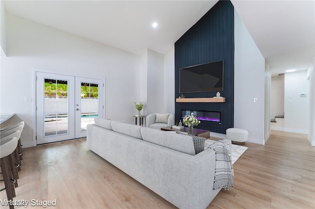 3409 El Cortez Ave, Las Vegas, NV 89102 - living area with light wood finished floors, french doors, baseboards, high vaulted ceiling, and recessed lighting