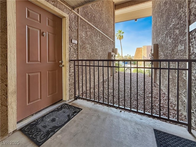4943 Indian River Dr Unit 133, Las Vegas, NV 89103 - entrance to property featuring a balcony and stucco siding