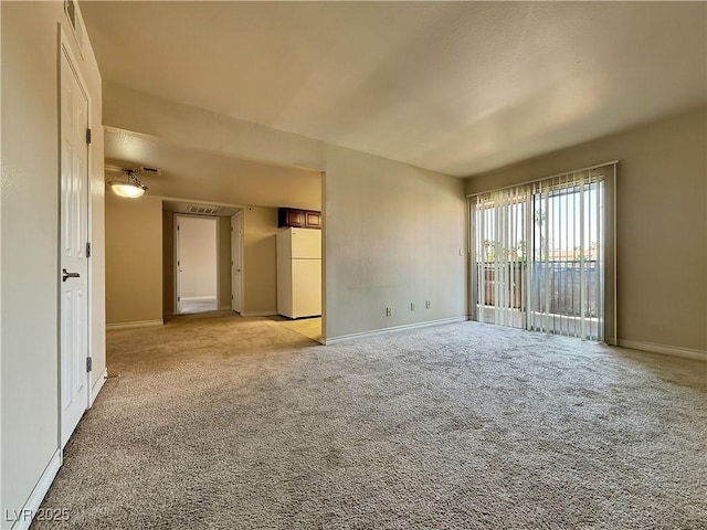 4943 Indian River Dr Unit 133, Las Vegas, NV 89103 - empty room with baseboards and light carpet