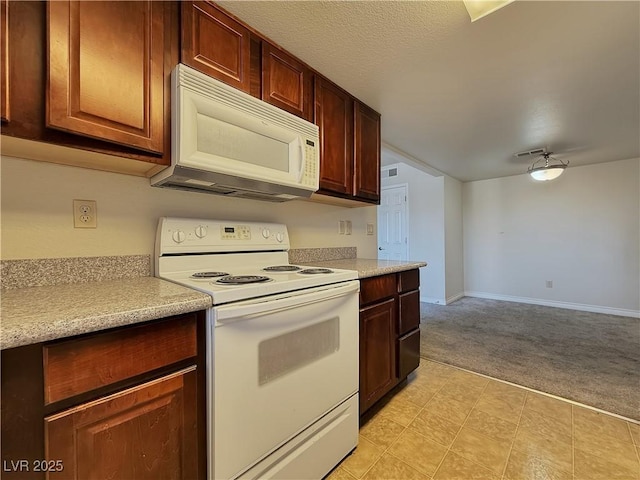 4943 Indian River Dr Unit 133, Las Vegas, NV 89103 - kitchen featuring white appliances, light carpet, light countertops, baseboards, and light floors