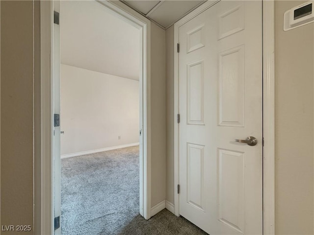 4943 Indian River Dr Unit 133, Las Vegas, NV 89103 - hallway featuring dark carpet and baseboards