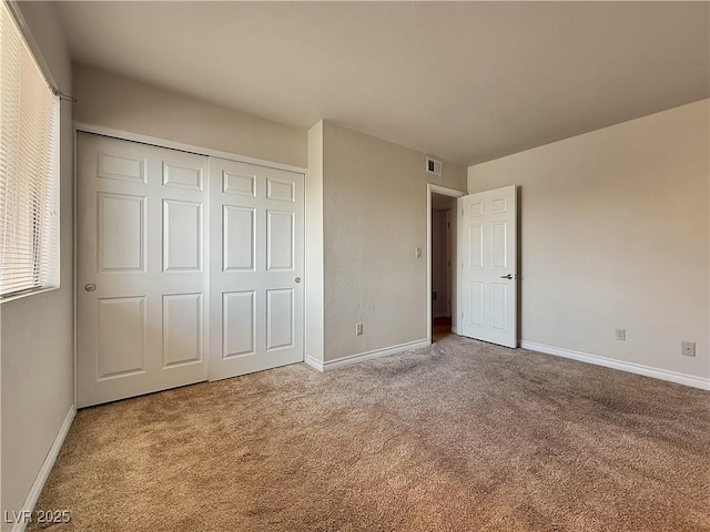 4943 Indian River Dr Unit 133, Las Vegas, NV 89103 - unfurnished bedroom featuring carpet, baseboards, and a closet