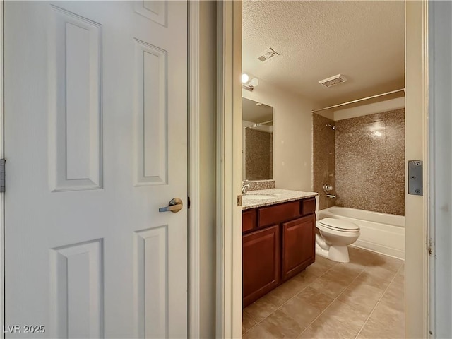 4943 Indian River Dr Unit 133, Las Vegas, NV 89103 - full bath featuring vanity, toilet, a textured ceiling,  shower combination, and tile patterned flooring